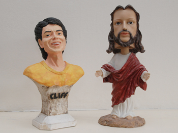 picture showing the cliff statuette with bobblehead jesus