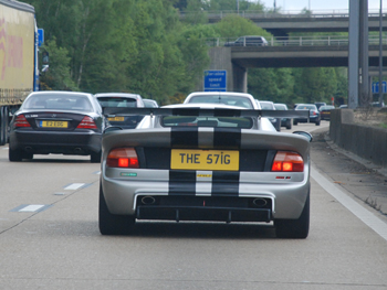 picture showing fast sports car on the motorway... registration tee aitch eee five seven eye gee... the stig