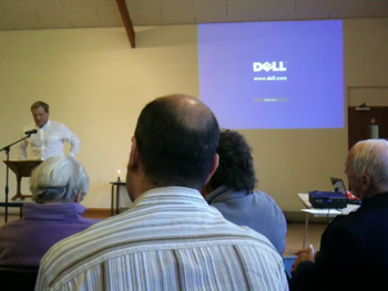 picture showing dire church hall interior, with a projected image on the wall saying dell no signal