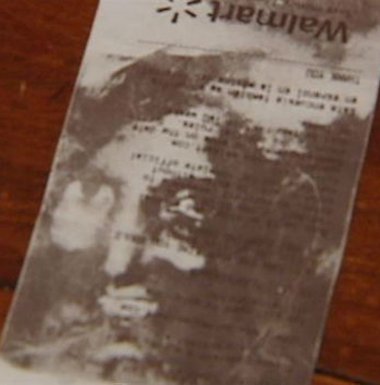 photo of the walmart receipt with a face on it